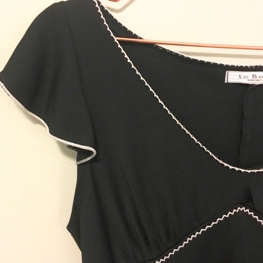 Black flutter sleeve white trim dress